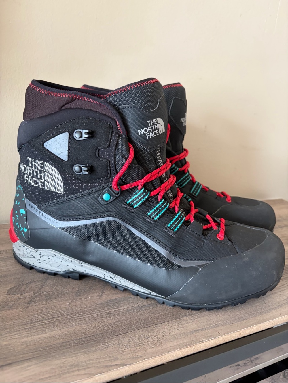 The North Face Black Hiking Boots with Red Laces and Teal Accents
